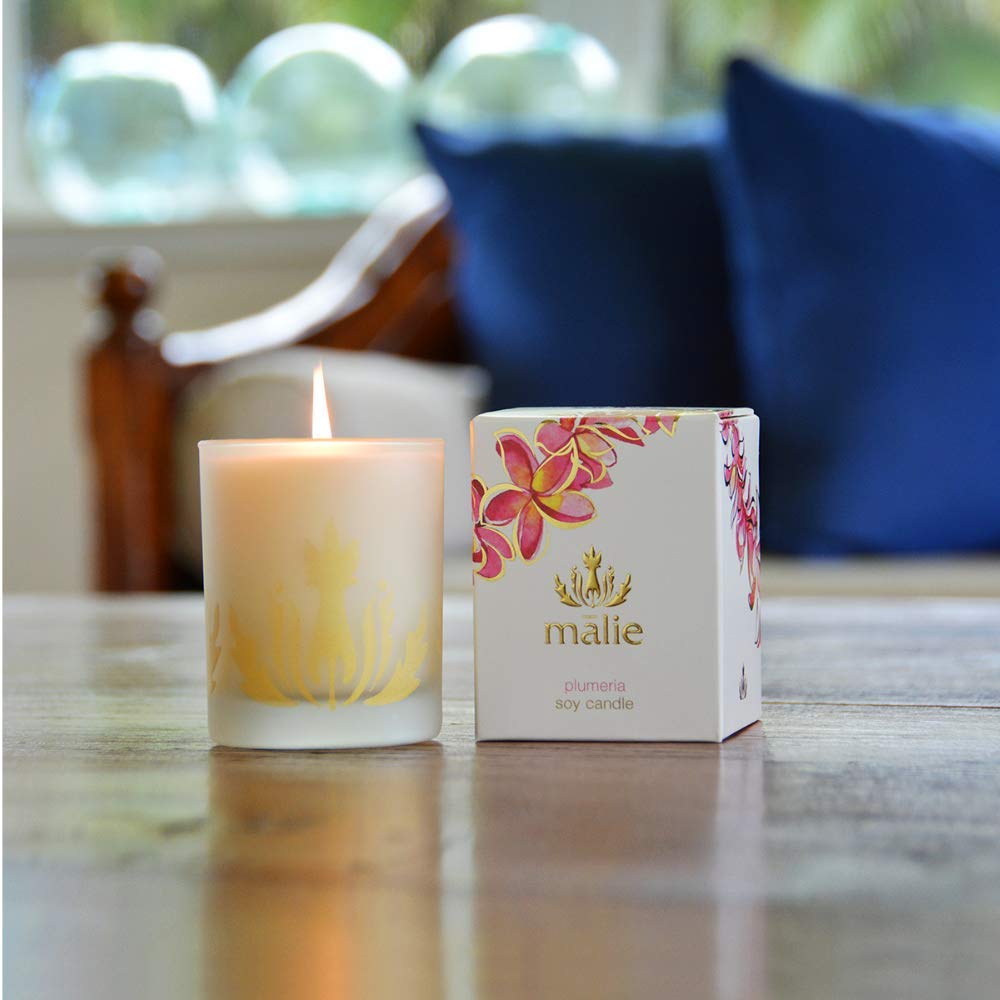 Malie's Plumeria 8 Oz Scented Soy Candle with clean-burning waxes & Hawaiian Aromatherapy, relax and immerse yourself in the serene air of the Hawaiian tropics.